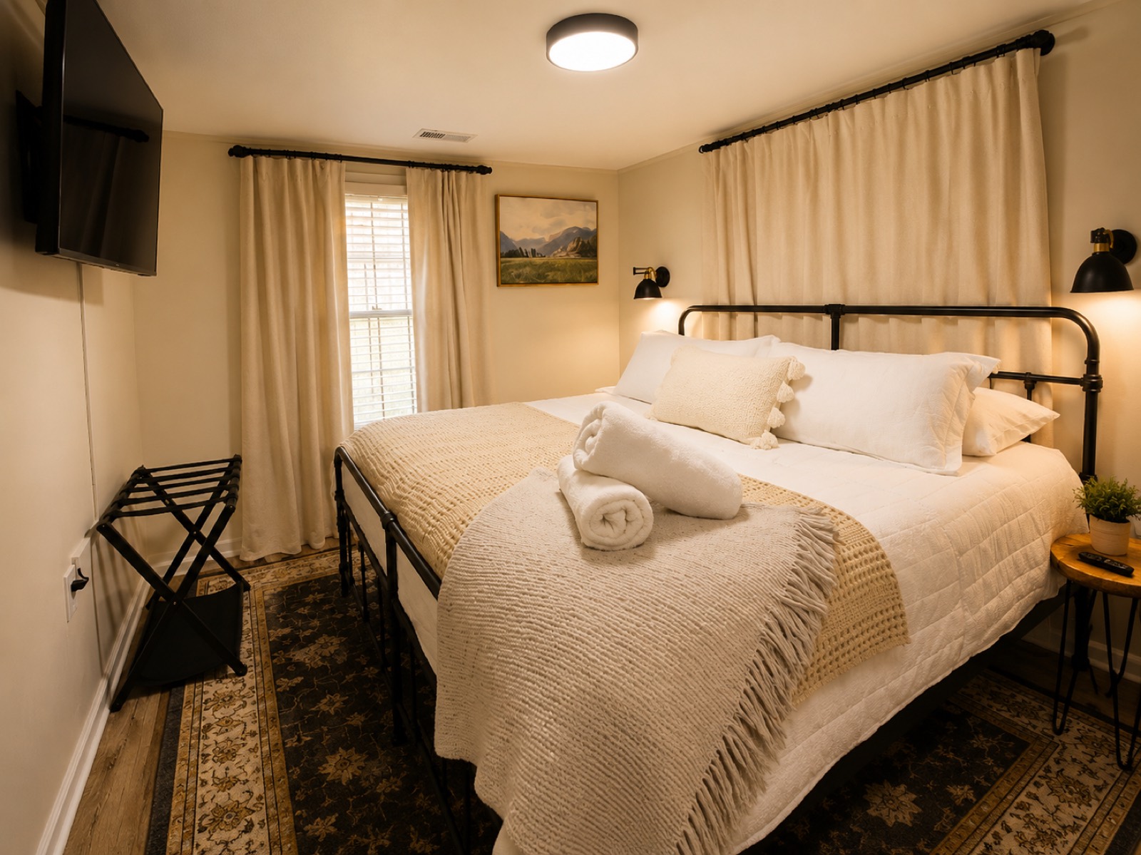 King bedroom with crisp white linens