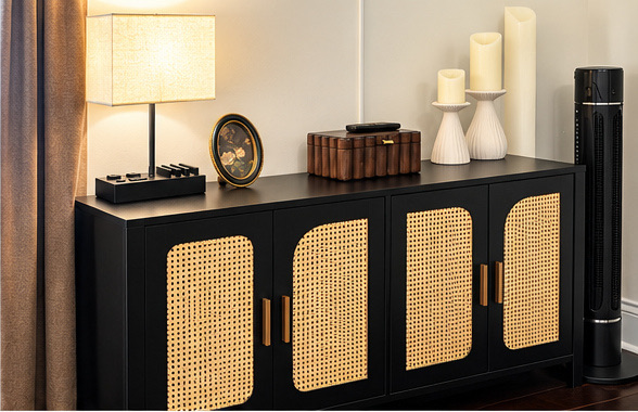 Black and rattan sideboard with lamp and decor