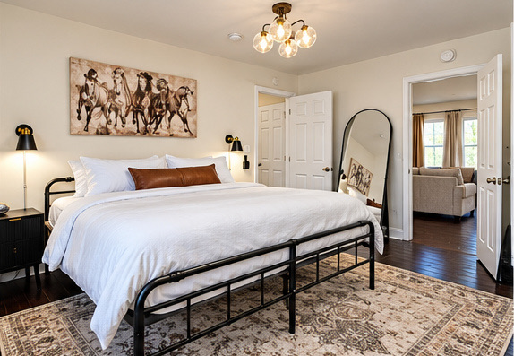 Bedroom with a chandelier and floor mirror
